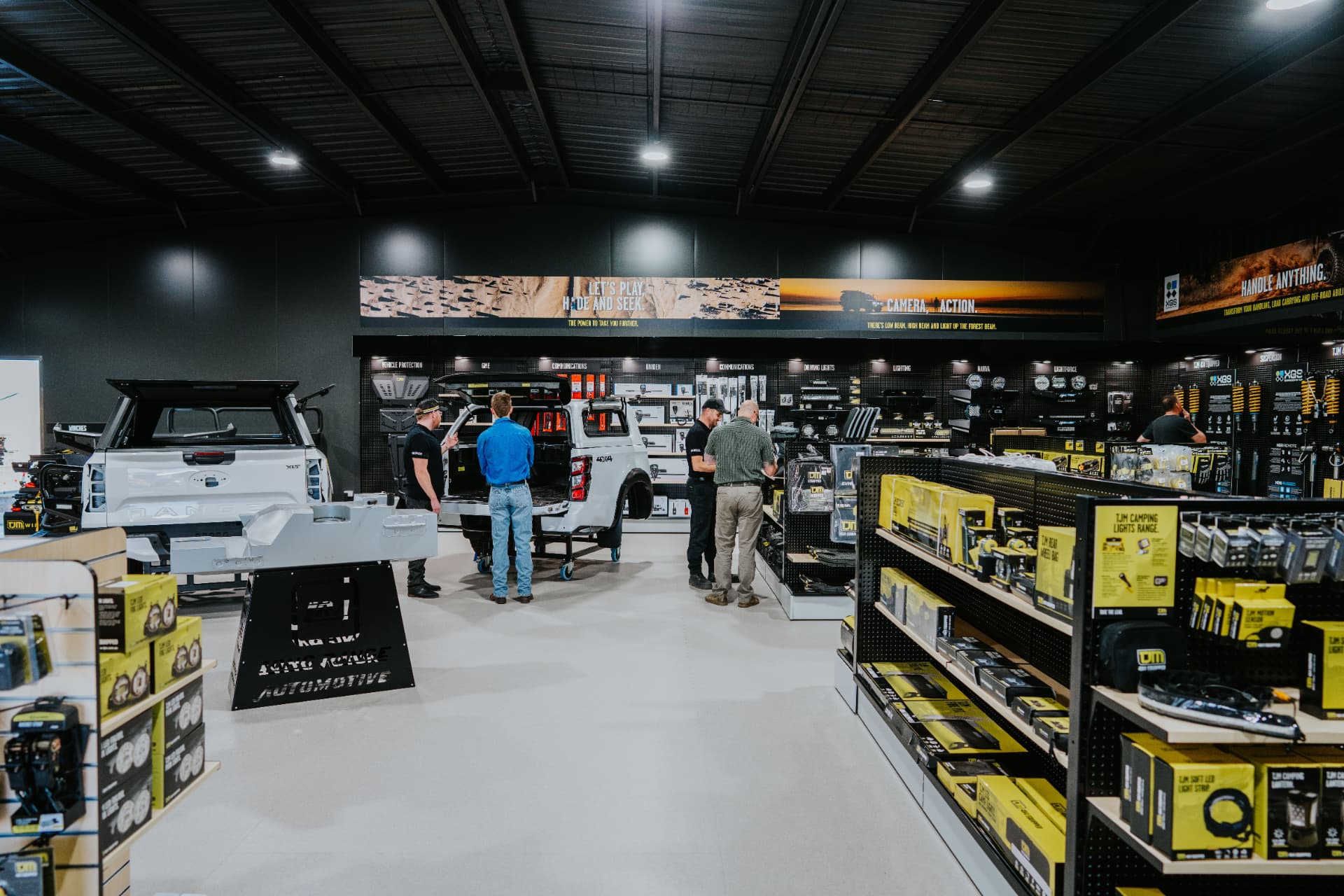 Completed automotive showroom fit-out with product displays and integrated signage