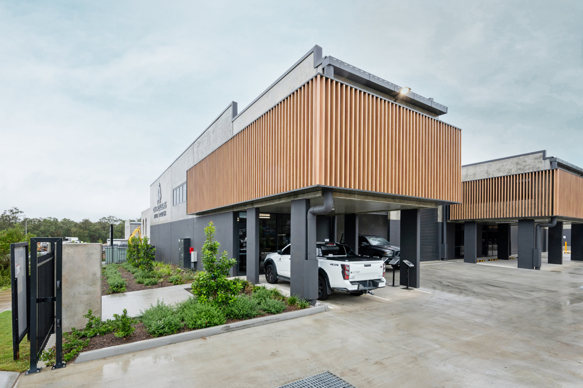 Completed contemporary commercial building exterior with timber screening